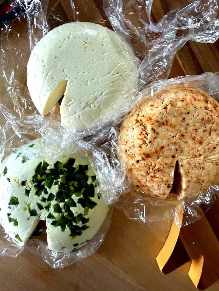 Plate of homemade fresh cheese with herbs and spices