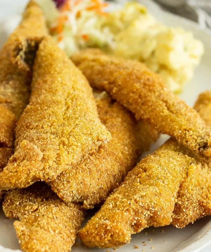 Delicious Southern pan-fried fish sizzling in a skillet.