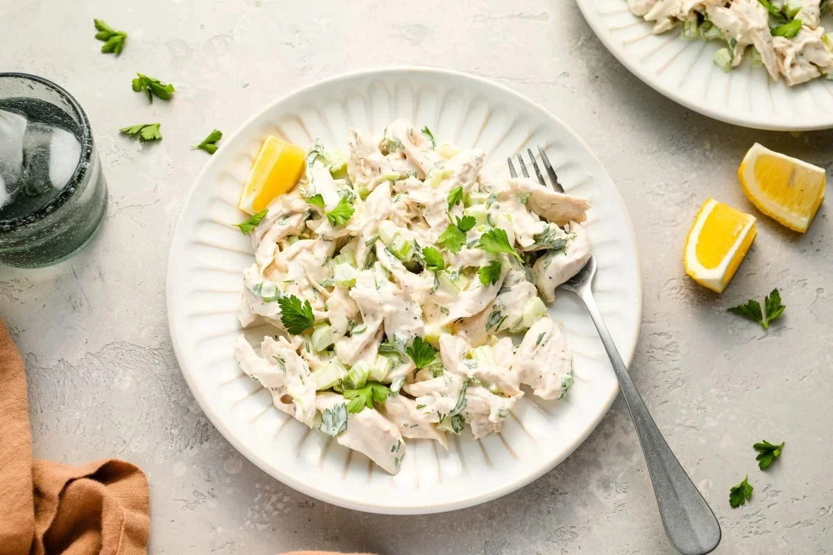 Delicious timeless chicken salad served in a bowl with fresh vegetables